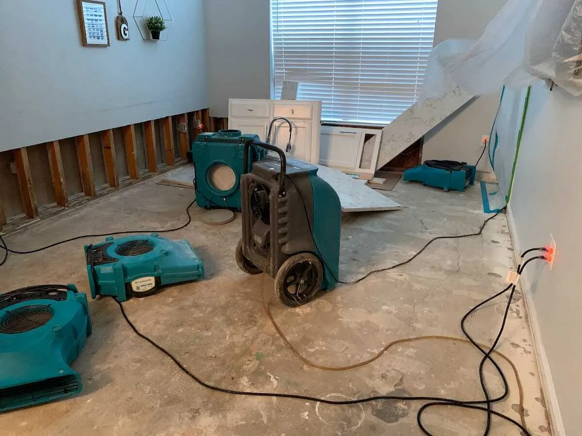 Dehumidifier in flood-cut room for Water Damage Restoration in Granger
